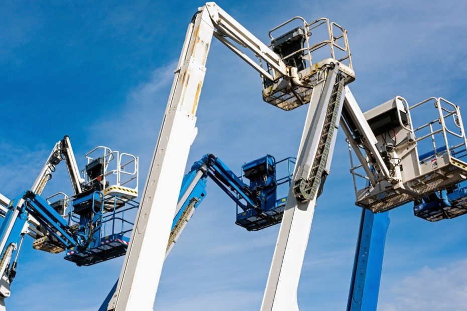 How to Train Your Team on Proper Spiderlift Usage 16 five blue and white jovoo lifts against a clear blue sky.