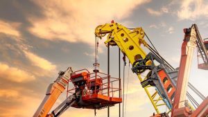 blog 11 A crane hoisting a massive jovoo lift with precision and strength.