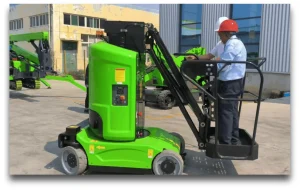 How can logistics warehouses use electric articulated boom lifts to optimize storage and picking? 1 A person is using the green JOVOO lift boom lift product.